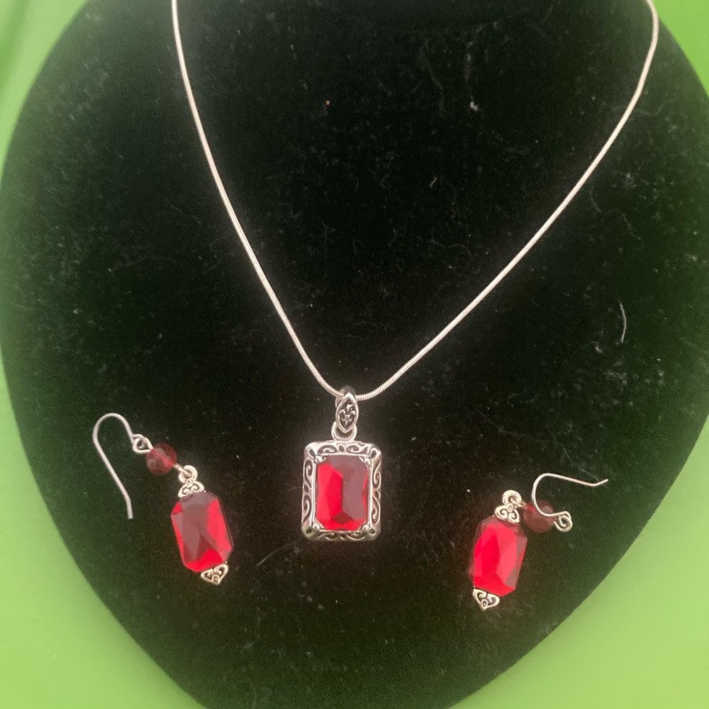 Women’s red necklace and earrings